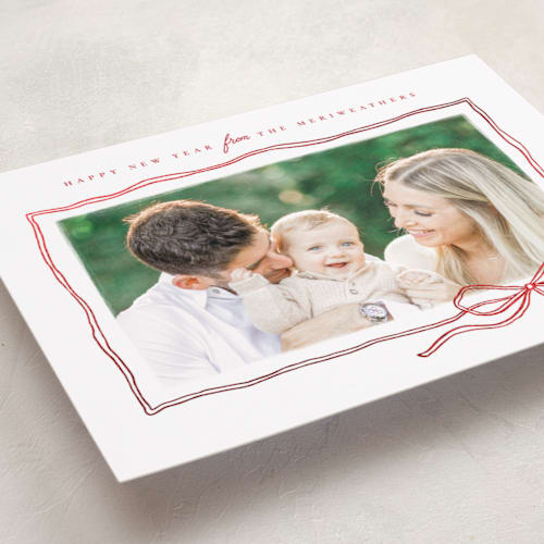 This is a ribbon foil pressed holiday cards with foil pressed by Wildfield Paper Co called bow sketch printing on recycled smooth signature in standard