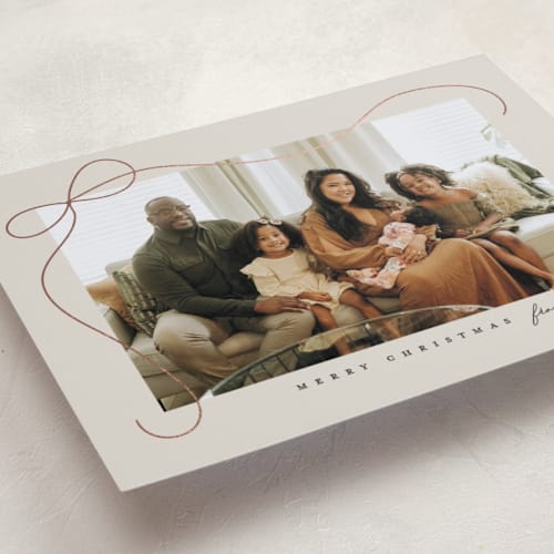 This is a putty foil pressed holiday cards with foil pressed by Lauren Chism called cascading bow printing on recycled smooth signature in standard