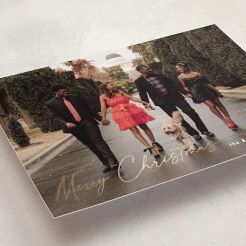 This is a ivory foil pressed holiday cards with foil pressed by Chris Griffith called holiday glee printing on recycled smooth signature in standard