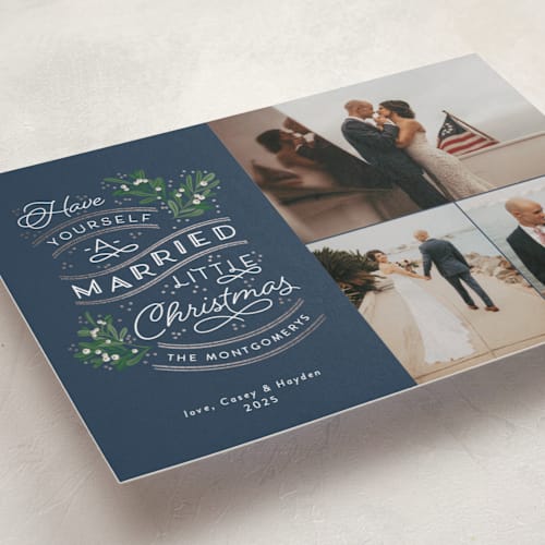 This is a navy foil pressed holiday cards with foil pressed by Sarah Brown called a little married printing on recycled smooth signature in standard