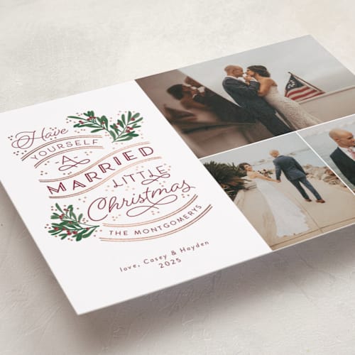 This is a cranberry foil pressed holiday cards with foil pressed by Sarah Brown called a little married printing on recycled smooth signature in standard