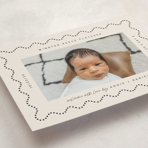This is a licorice birth announcements with standard by Kelly Watkins called squiggle printing on signature in standard