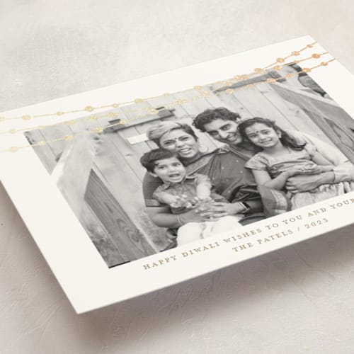 This is a champagne diwali cards with foil pressed by Kate Ross called under lights printing on signature in standard