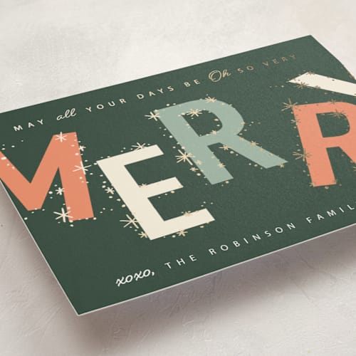 This is a evergreen foil pressed holiday cards with foil pressed by Hannah Williams called merry & bright stars printing on signature in standard