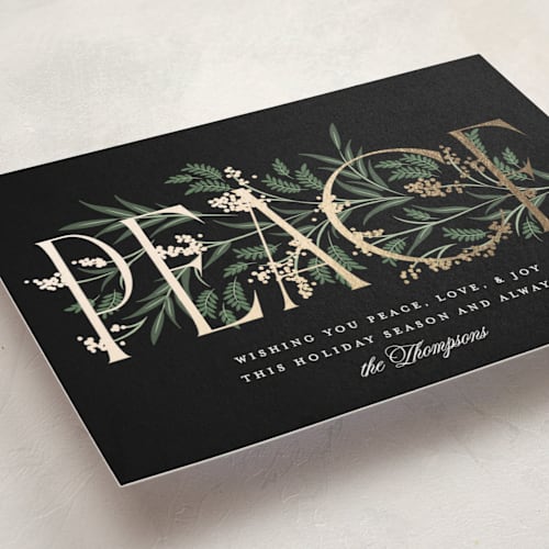 This is a coal foil pressed holiday cards with foil pressed by Robert and Stella called entwined peace printing on signature in standard