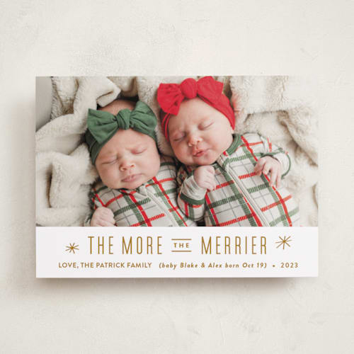 This is a golden babys first christmas with standard by Carolyn MacLaren called the more, the merrier printing on recycled smooth signature in standard