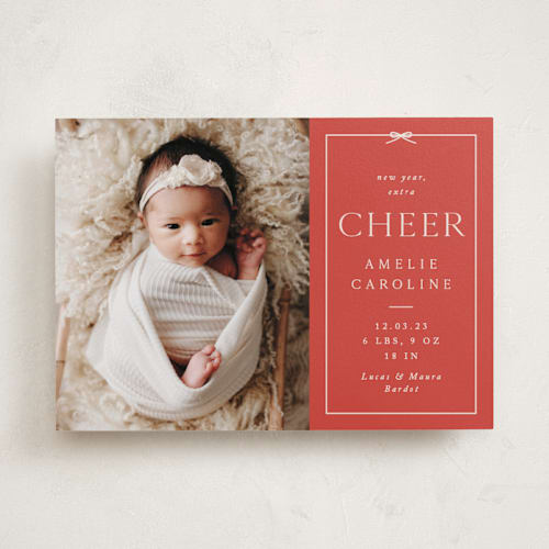 This is a ruby babys first christmas with standard by Olivia Raufman called petite bow printing on recycled smooth signature in standard