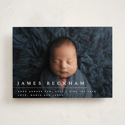 This is a snowfall foil stamped birth announcements with foil pressed by Melanie Kosuge called minimalist printing on recycled smooth signature in standard