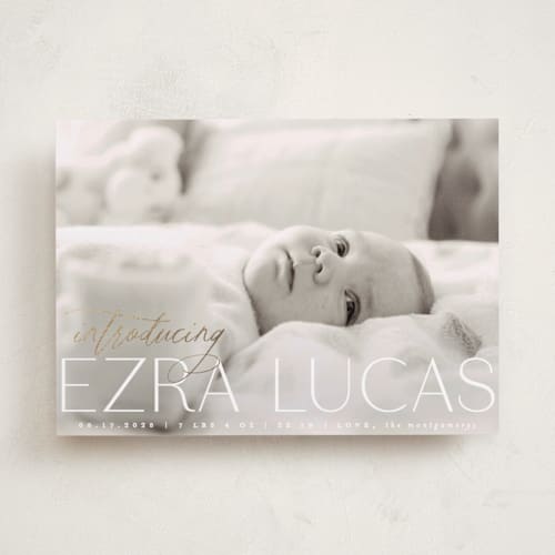 This is a ice foil stamped birth announcements with foil pressed by Everett Paper Goods called flourished printing on smooth signature in standard