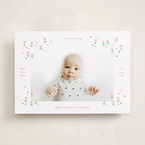 This is a spring birth announcements with standard by Phrosné Barwood called tiny blooms printing on recycled smooth signature in standard