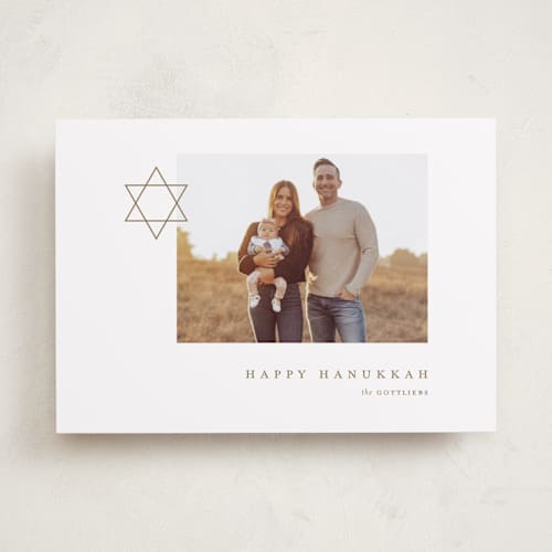 This is a golden hanukkah cards with standard by Alexandra Cohn called modern star of david printing on recycled smooth signature in standard