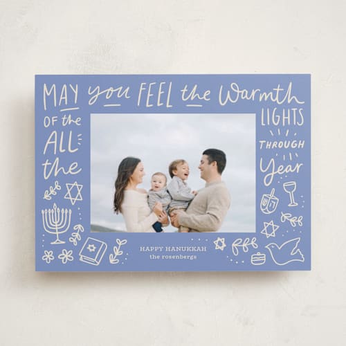 This is a robin blue hanukkah cards with standard by Abbigail Lim called warmth of the lights printing on recycled smooth signature in standard