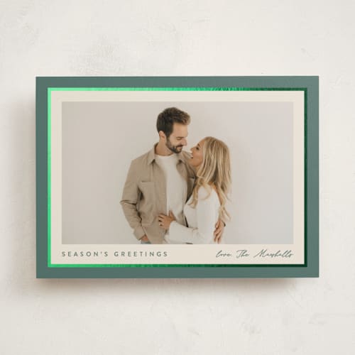 This is a holly sprig foil pressed holiday cards with foil pressed by Carolyn MacLaren called ribbon frame printing on recycled smooth signature in standard