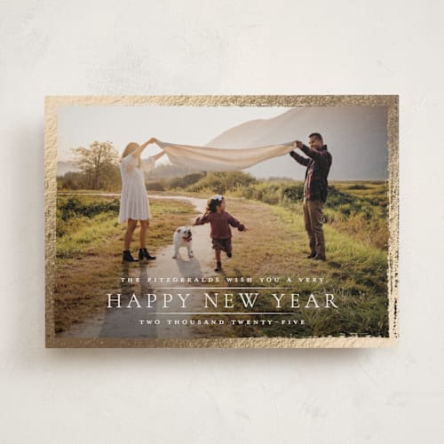 This is a lily foil pressed holiday cards with foil pressed by Wildfield Paper Co called festive holiday border printing on recycled smooth signature in standard
