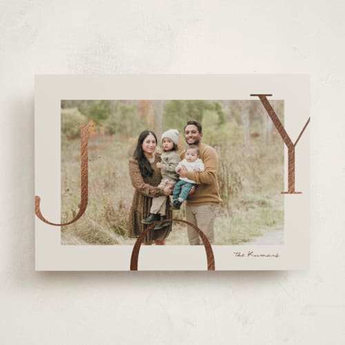This is a cookie dough foil pressed holiday cards with foil pressed by Brianne Larsen called joy border printing on recycled smooth signature in standard