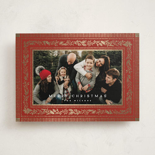 This is a cranberry foil pressed holiday cards with foil pressed by Laura Hankins called gilt greens printing on recycled smooth signature in standard