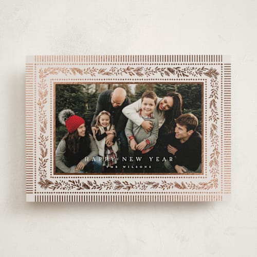 This is a marshmallow foil pressed holiday cards with foil pressed by Laura Hankins called gilt greens printing on recycled smooth signature in standard