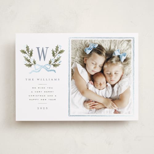 This is a blue spruce foil pressed holiday cards with foil pressed by Wildfield Paper Co called holly monogram printing on recycled smooth signature in standard