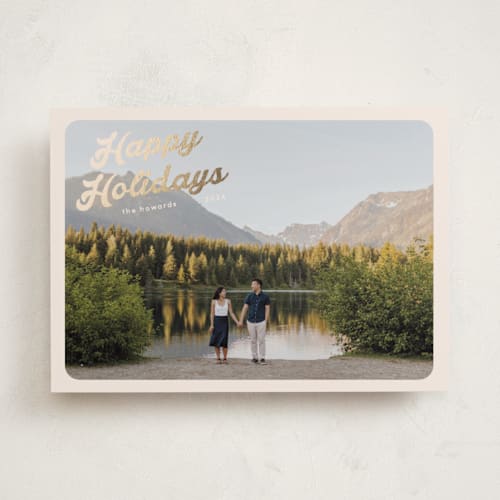 This is a buttercream foil pressed holiday cards with foil pressed by Morgan Kendall called vintage postcard printing on recycled smooth signature in standard