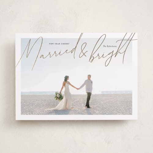 This is a gilded foil pressed holiday cards with foil pressed by Shari Margolin called shining newlyweds printing on recycled smooth signature in standard