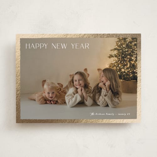This is a sugar foil pressed holiday cards with foil pressed by Hooray Creative called gilded border printing on recycled smooth signature in standard
