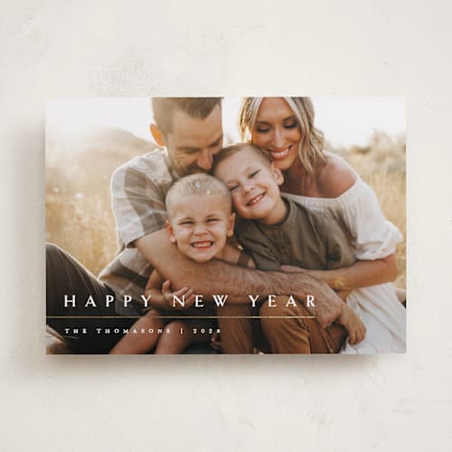 This is a snowfall foil pressed holiday cards with foil pressed by Melanie Kosuge called minimalist printing on recycled smooth signature in standard