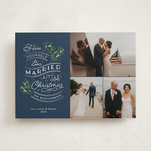 This is a navy foil pressed holiday cards with foil pressed by Sarah Brown called a little married printing on recycled smooth signature in standard