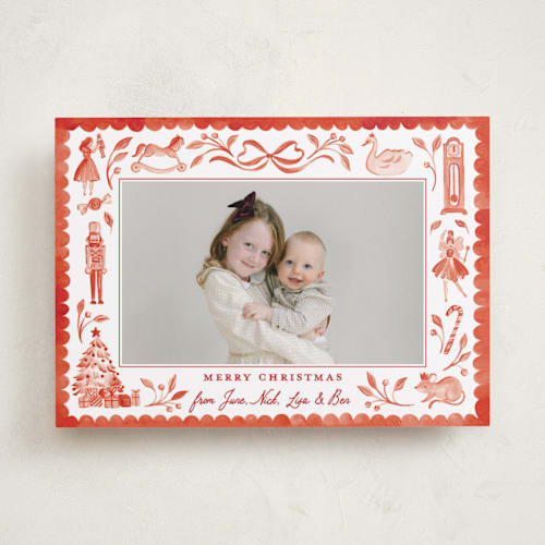 This is a red ribbon holiday photo cards with standard by Sarah Knight called the nutcracker printing on recycled smooth signature in standard