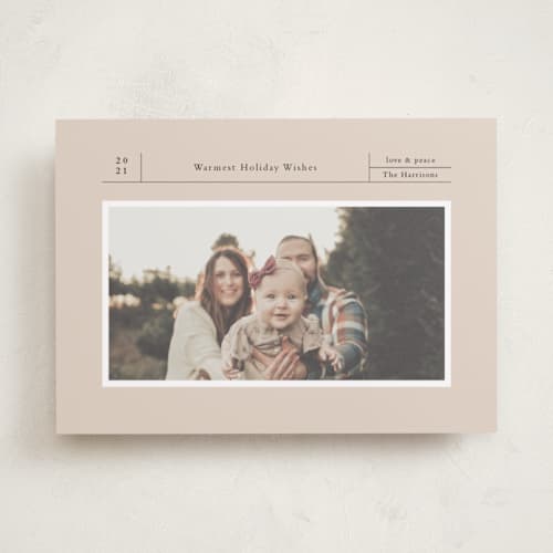 This is a sand holiday photo cards with standard by Wendy Chung called archival holiday printing on recycled smooth signature in standard