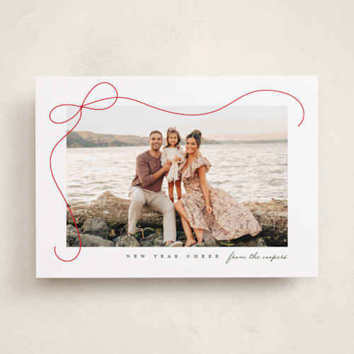 This is a snow holiday photo cards with standard by Lauren Chism called cascading bow printing on recycled smooth signature in standard