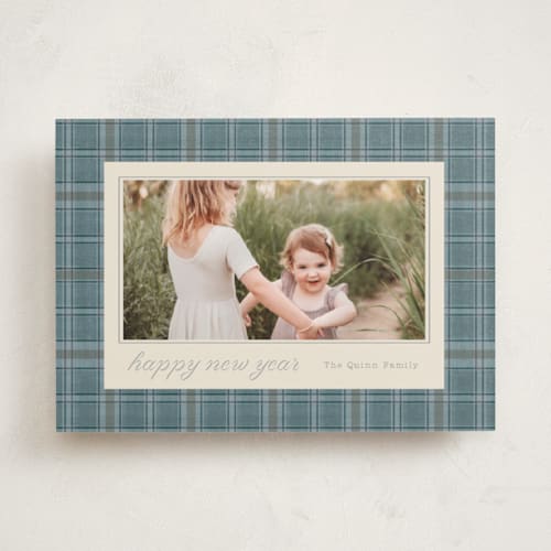 This is a powder blue holiday photo cards with standard by Baumbirdy called traditional plaid printing on recycled smooth signature in standard