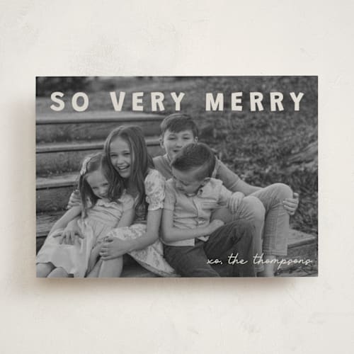 This is a cream holiday photo cards with standard by Jenny Millington called merry greeting printing on recycled smooth signature in standard