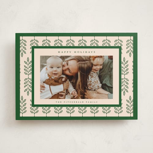 This is a pine holiday photo cards with standard by Nazia Hyder called folklore holiday printing on recycled smooth signature in standard