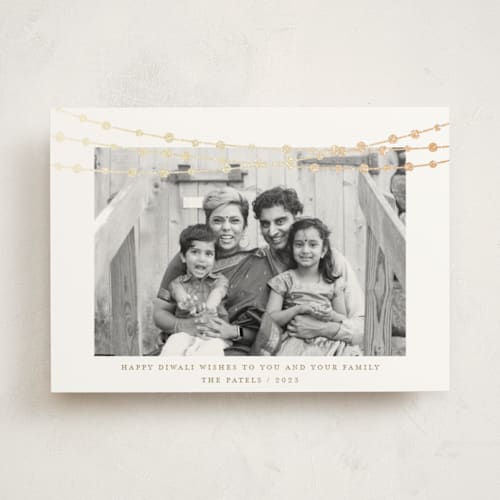 This is a champagne diwali cards with foil pressed by Kate Ross called under lights printing on signature in standard