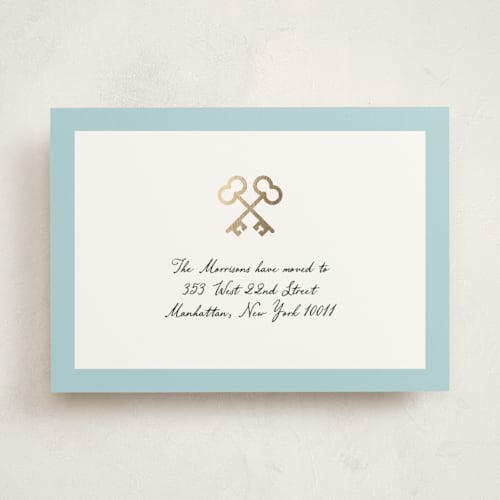 This is a blue skies moving announcements with foil pressed by mo kelley called crossed keys printing on signature in standard