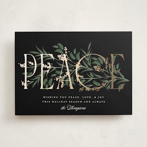 This is a coal foil pressed holiday cards with foil pressed by Robert and Stella called entwined peace printing on signature in standard