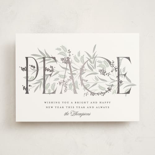 This is a snow foil pressed holiday cards with foil pressed by Robert and Stella called entwined peace printing on signature in standard