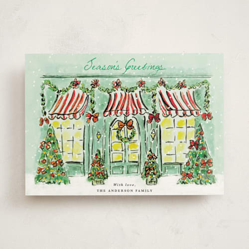 This is a frosted mint non photo holiday cards with standard by Cass Loh called the jolly storefront printing on signature in standard