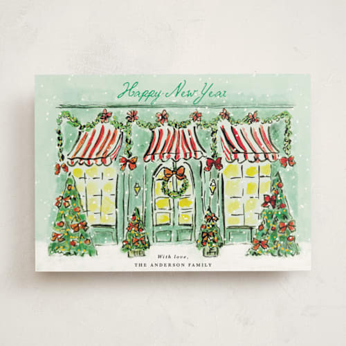 This is a frosted mint non photo holiday cards with standard by Cass Loh called the jolly storefront printing on signature in standard