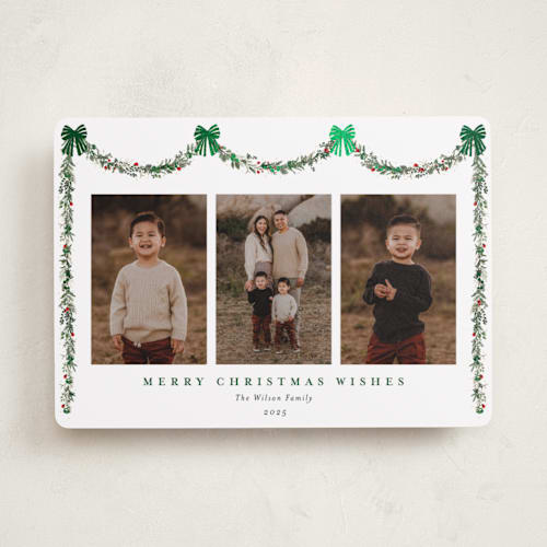 This is a evergreen foil pressed holiday cards with foil pressed by Susan Moyal called joyful holly printing on recycled smooth signature in standard