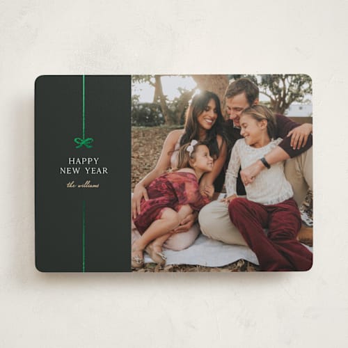 This is a jade foil pressed holiday cards with foil pressed by Pixel and Hank called bow printing on recycled smooth signature in standard