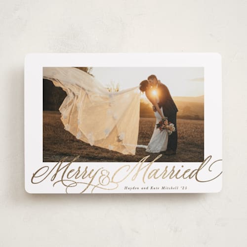 This is a cinnamon foil pressed holiday cards with foil pressed by Hooray Creative called elegantly married printing on recycled smooth signature in standard