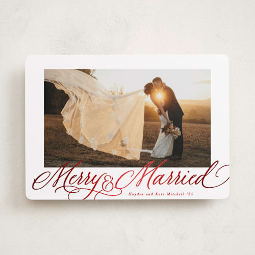 This is a poinsettia foil pressed holiday cards with foil pressed by Hooray Creative called elegantly married printing on recycled smooth signature in standard