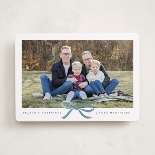 This is a mist foil pressed holiday cards with foil pressed by Olivia Kanaley Inman called crimson bow printing on recycled smooth signature in standard