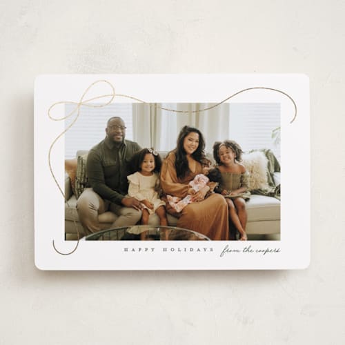 This is a snow foil pressed holiday cards with foil pressed by Lauren Chism called cascading bow printing on recycled smooth signature in standard