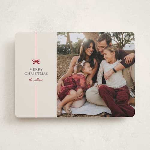 This is a poinsettia holiday photo cards with standard by Pixel and Hank called bow printing on recycled smooth signature in standard