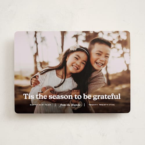 This is a snow holiday photo cards with standard by Annie Clark called warmth printing on recycled smooth signature in standard