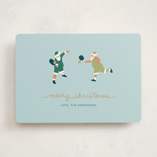 This is a aqua non photo holiday cards with standard by tara berg called pickleball santa printing on signature in standard