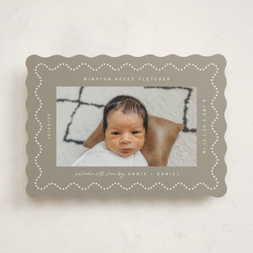 This is a sand birth announcements with standard by Kelly Watkins called squiggle printing on signature in standard
