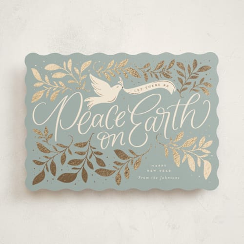 This is a blue spruce foil pressed holiday cards with foil pressed by Erin German called botanical peace on earth printing on signature in standard